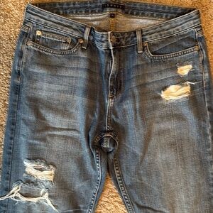 Distressed denim jeans